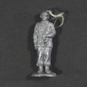 WWII German WHW Fallschirmjäger grey plastic miniature figure front view with helmet and original string loop