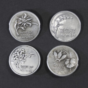 WWII German WHW 1938/39 Gau Wien set of four aluminum flower tinnies front view