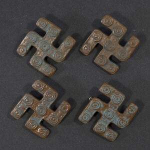 WWII German WHW Klethen Kreis Stade set of four swastika-shaped plastic tinnies front view