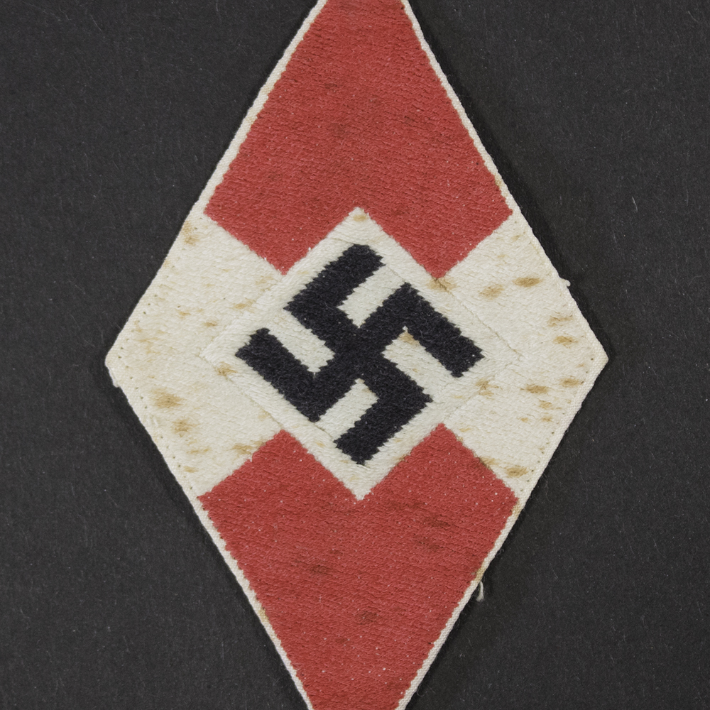 WWII German HJ BDM Diamond Sleeve Patch close-up of woven swastika emblem