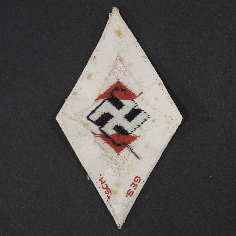 WWII German HJ BDM Diamond Sleeve Patch reverse showing red Ges Gesch stamp