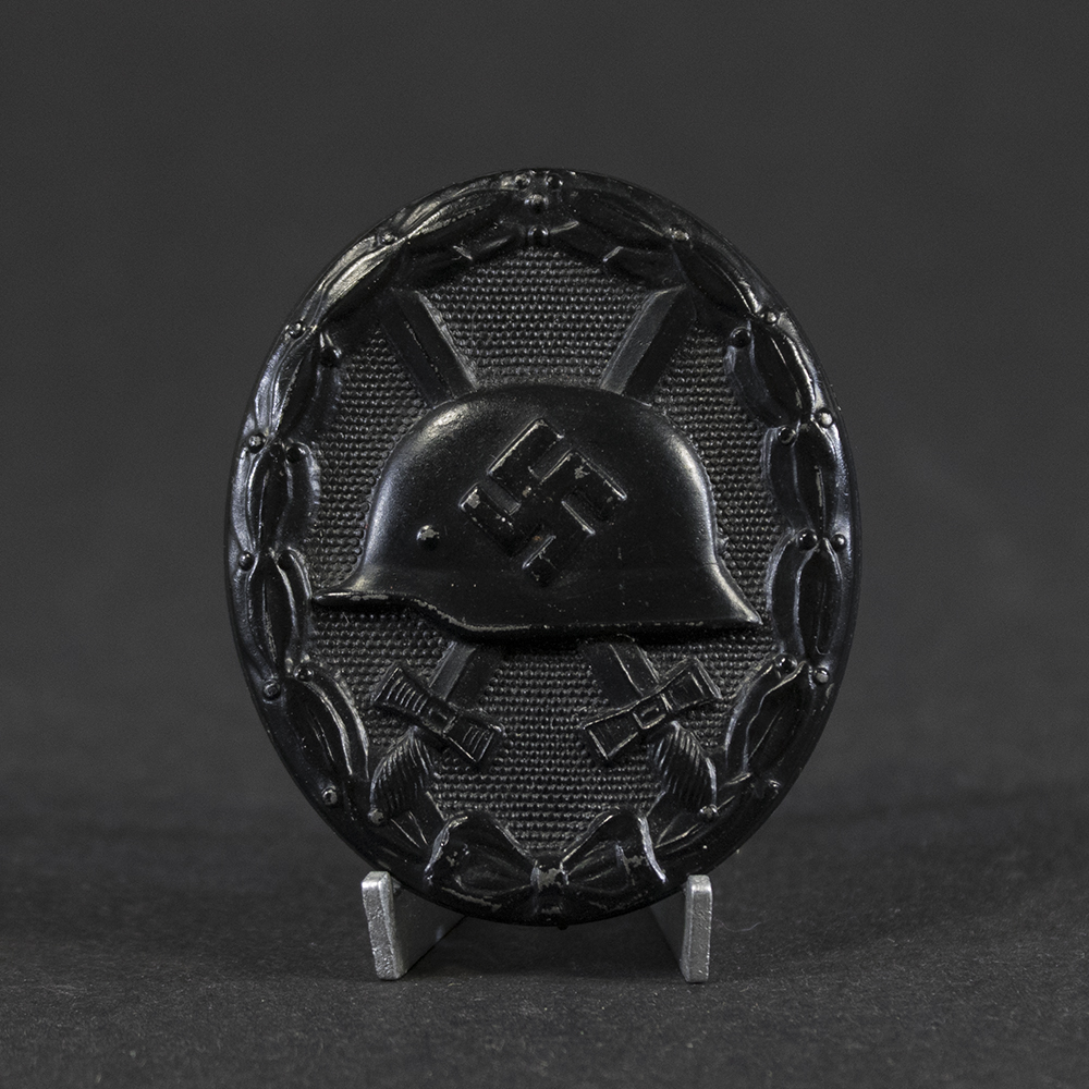 WWII German Black Wound Badge front view on display stand